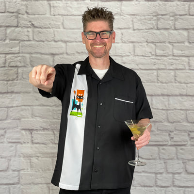 Scooter's loose, comfortable, and airy "Miss Whiskers" Single Panel Bowling Shirt is great for all you cool cats out there! It features an embroidered single white panel on a black polyester shirt and features contrast piping on the breast pocket.  
