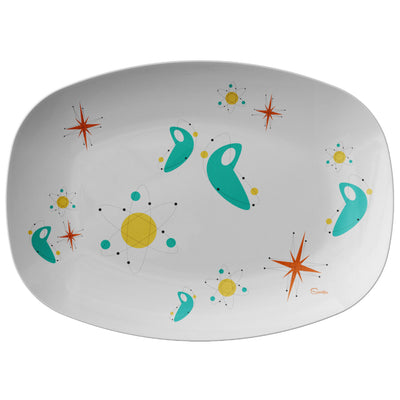 Scooter’s super fun, custom “Sci-Fi” 10x14” Serving Platter is the perfect retro addition to any dinner table! The “Sci-Fi” design is inspired by the atomic retro, space shapes, colors and designs from the 1950’s. These serving platters are manufactured from revolutionary ThermoSāf® Polymer that is: 