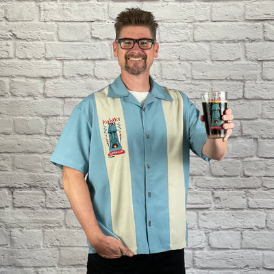 This loose, comfortable, and airy "Kahiki Tiki Supper Club" PopCheck Double Panel Bowling Shirt in Sea Foam/Stone is great for all you tiki lovers out there! It features the infamous tiki from the The Kahiki Supper Club, embroidered on a single stone panel of the sea foam polyester shirt and features custom metal tiki buttons! 